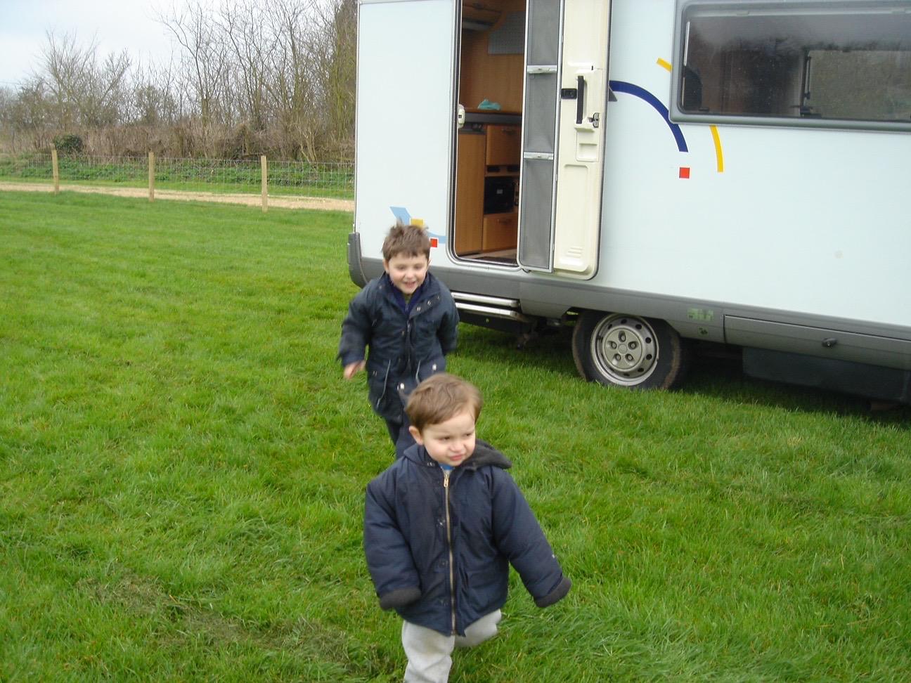 Isaac as a young child with family on a camping trip